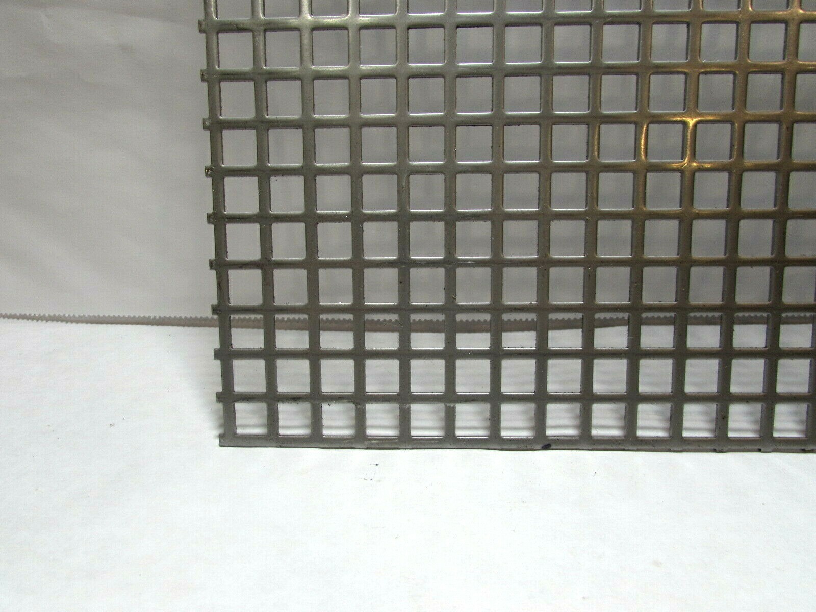 ==3/8″ SQUARE—- 16 GA. STAINLESS PERFORATED METAL —12-1/8″ x 10-7/8″==