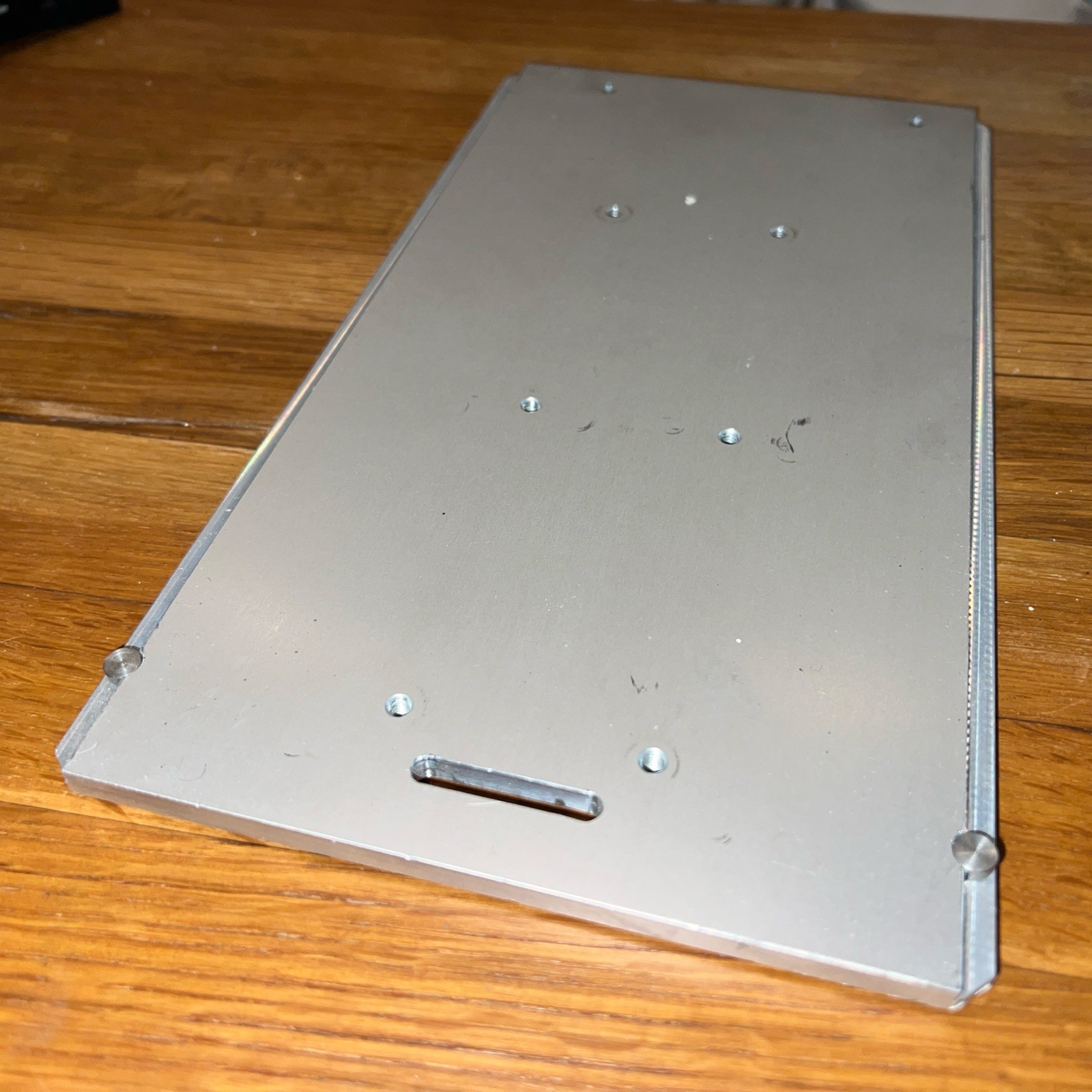 1/4″ Steel Plate, 10.5” x 5 5/16” with 8 screw holes