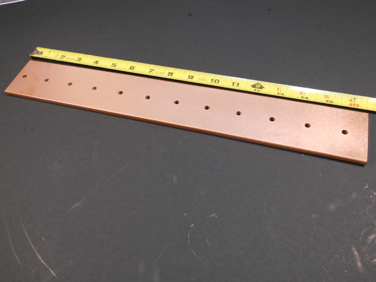 1/4″ thick ,2 3/8″ x 16 3/8″ copper 110 buss bar. Weight 3.2Lb.