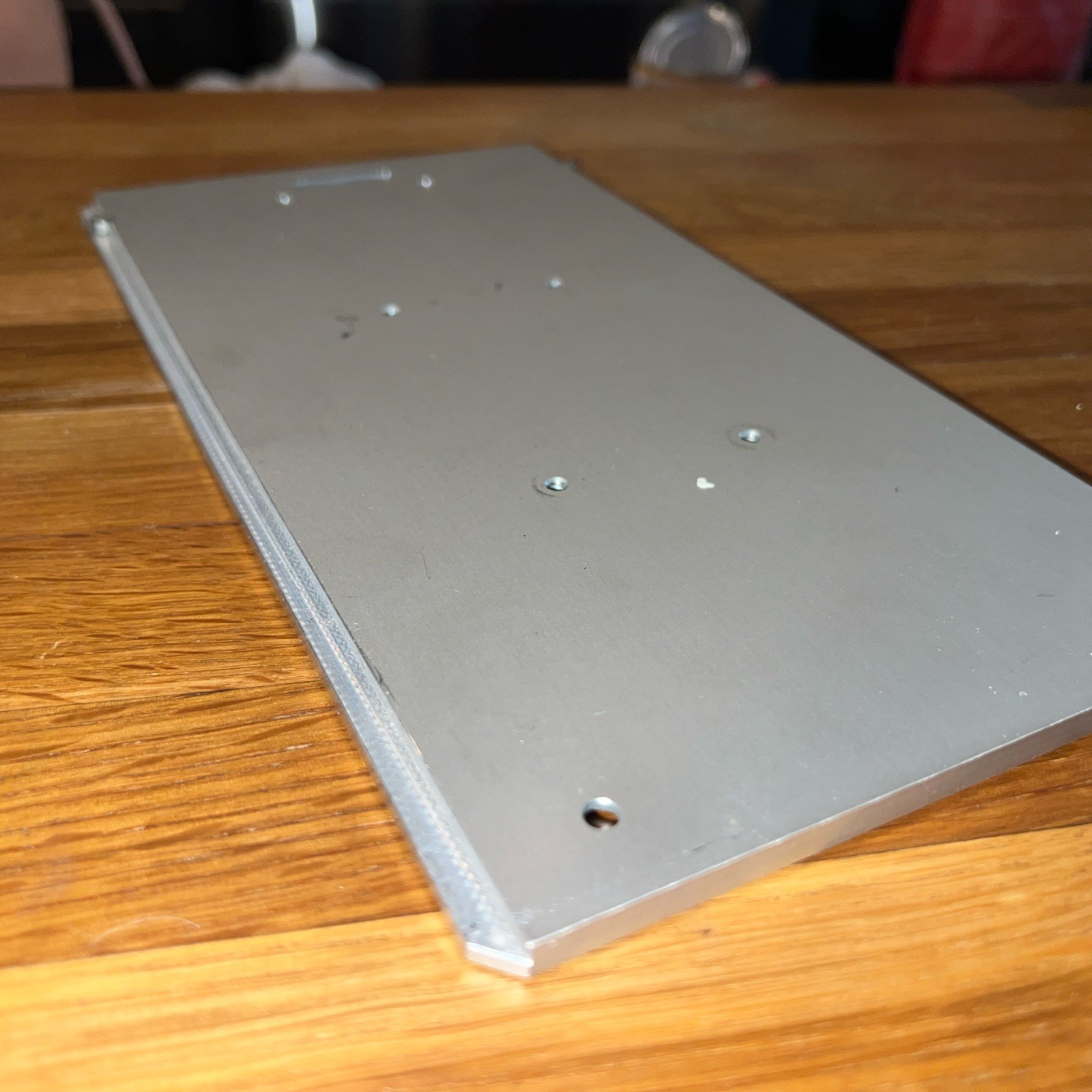 1/4″ Steel Plate, 10.5” x 5 5/16” with 8 screw holes