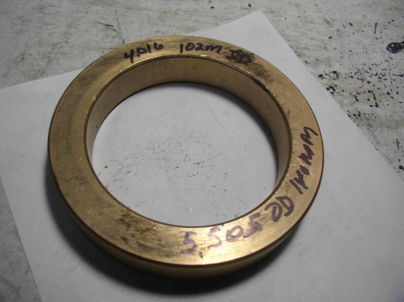 BRASS BUSHION 5.505″ OD. X 4.016″ ID W X 15/16 LONG (102MM X 140MM CLOSE TO)