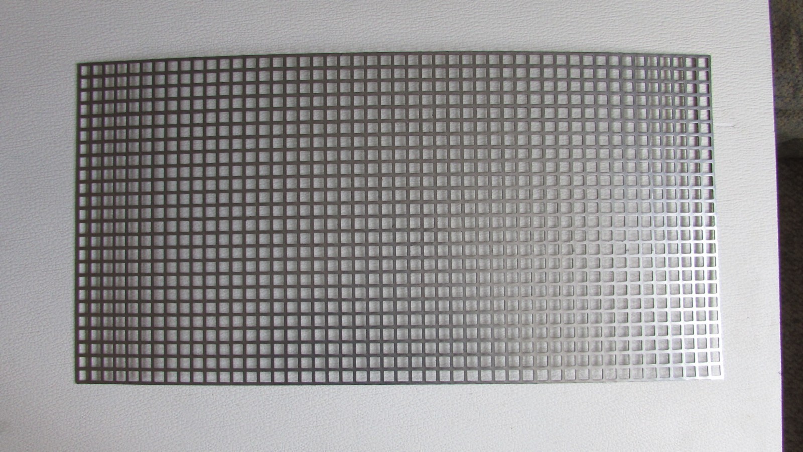 3/8″ SQUARE—- 16 GA. STAINLESS PERFORATED METAL —5-1/2″ x 23-3/4″