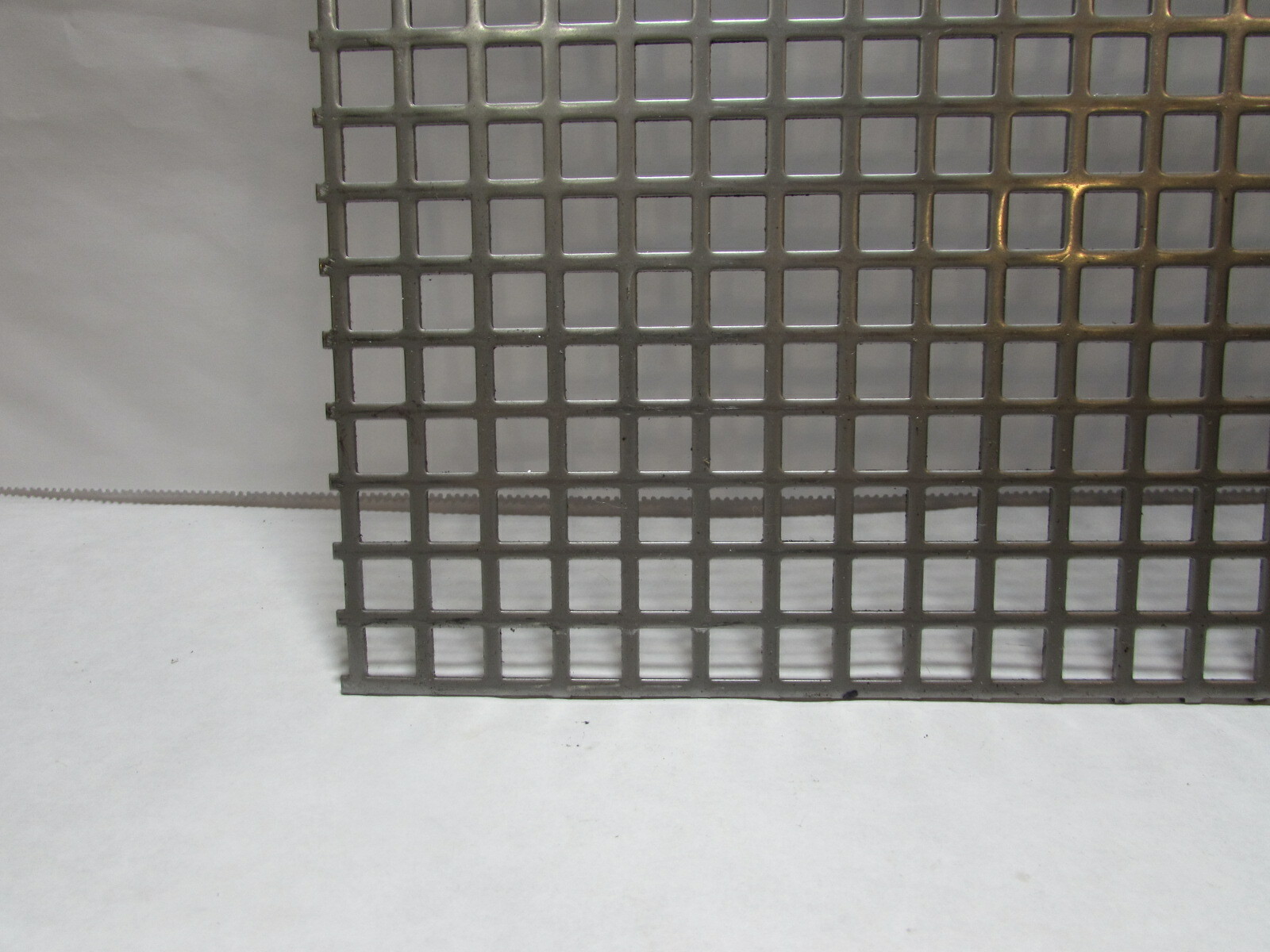 3/8″ SQUARE ON 1/2″ CENTERS 16 GA STAINLESS STEEL PERFORATED -7-5/8″ x 13″