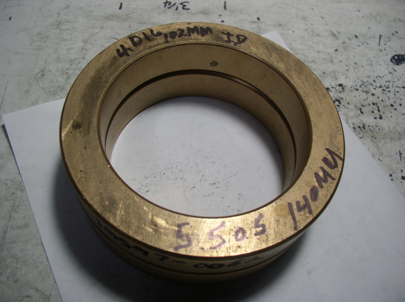 BRASS BUSHION 5.505″ OD. X 4.016″ ID W X 15/16 LONG (102MM X 140MM CLOSE TO)