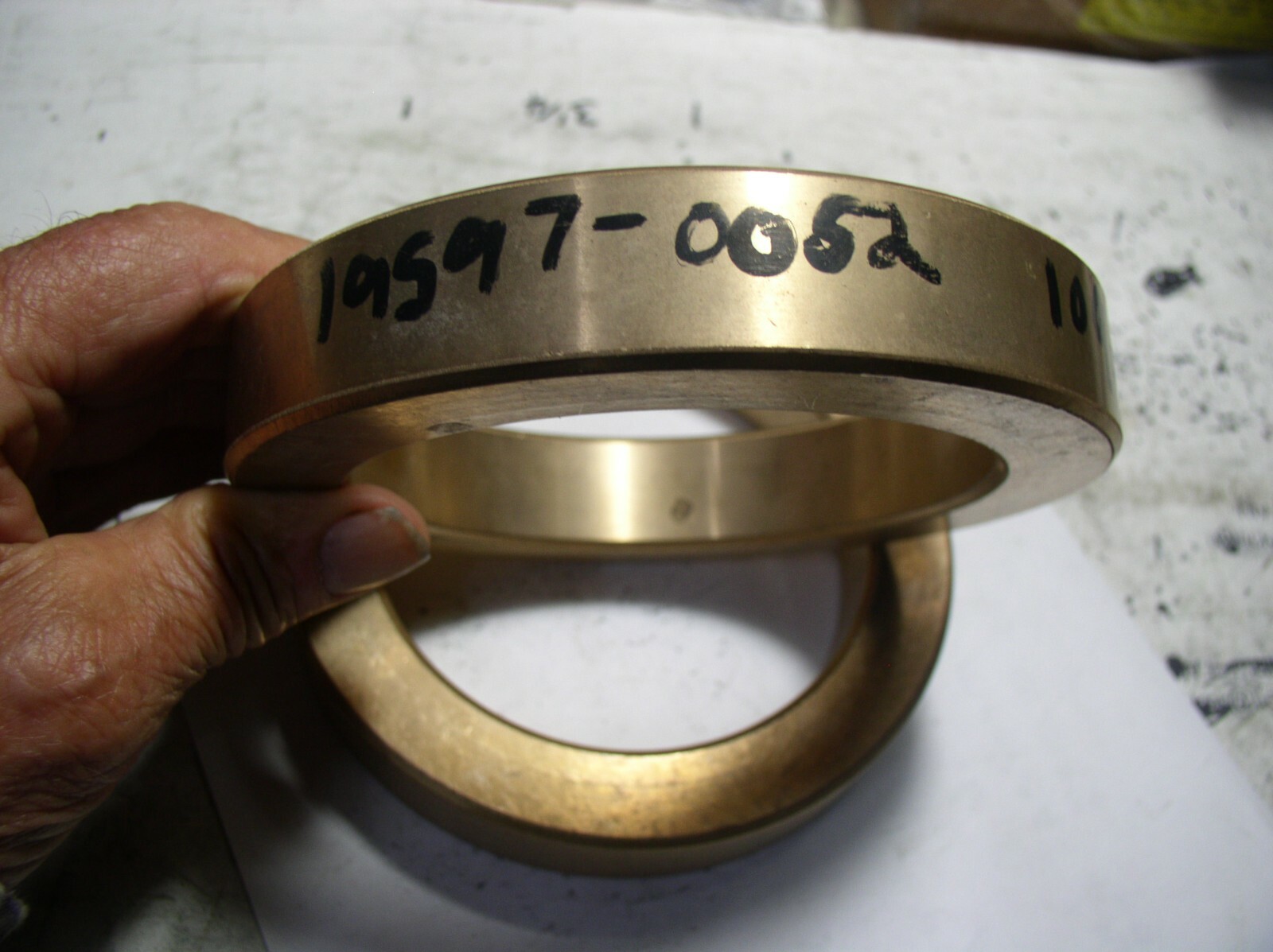 BRASS BUSHION 5.505″ OD. X 4.016″ ID W X 15/16 LONG (102MM X 140MM CLOSE TO)