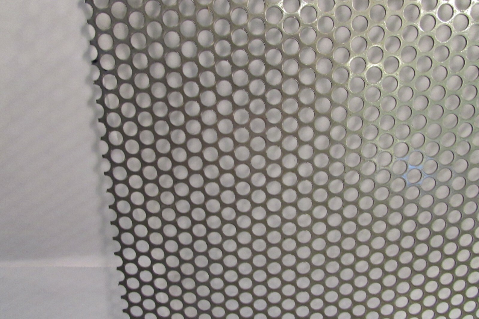 1/4″HOLES ON 5/16″CENTER–20 GA. STAINLESS PERFORATED SHEET–6″ X 8-1/4″