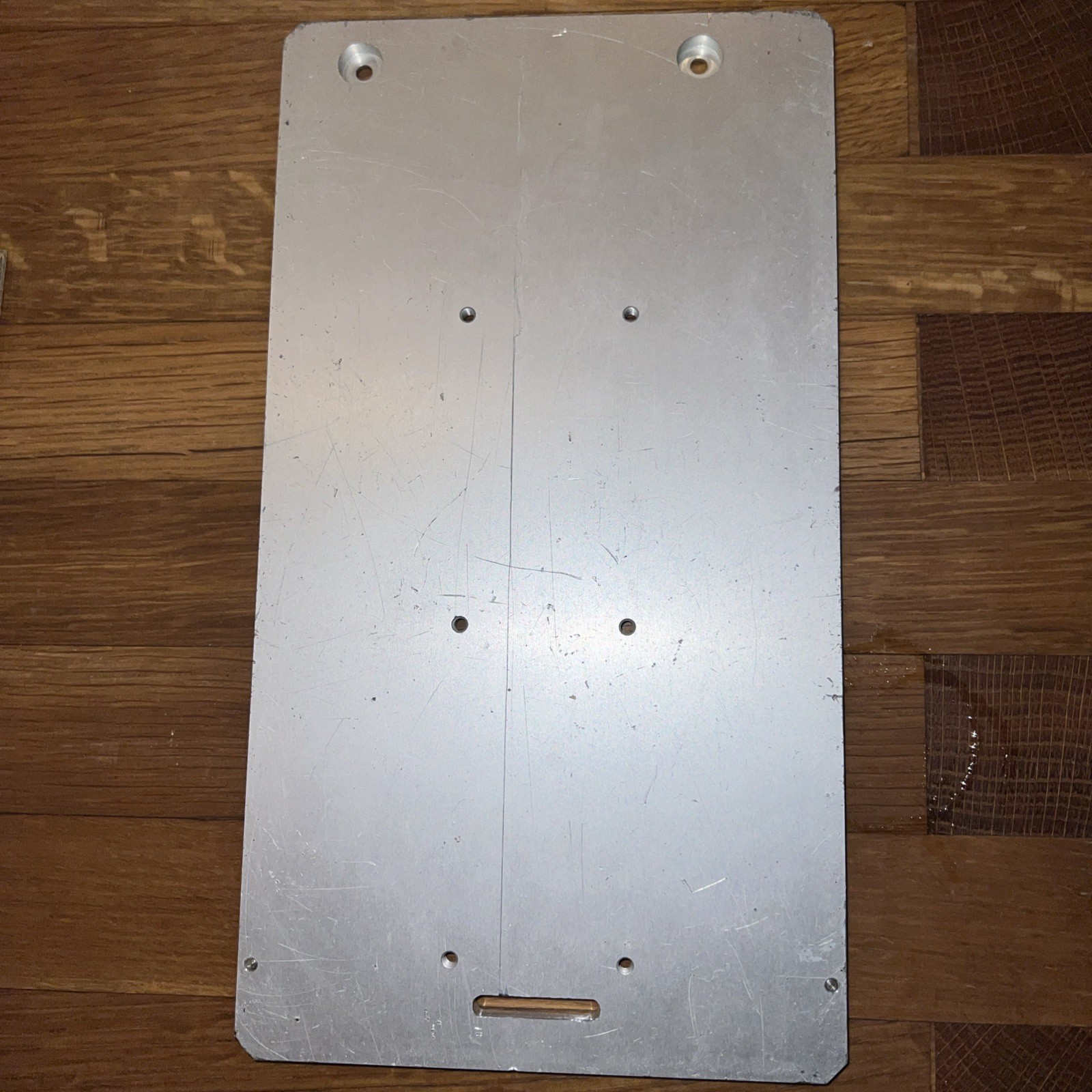 1/4″ Steel Plate, 10.5” x 5 5/16” with 8 screw holes