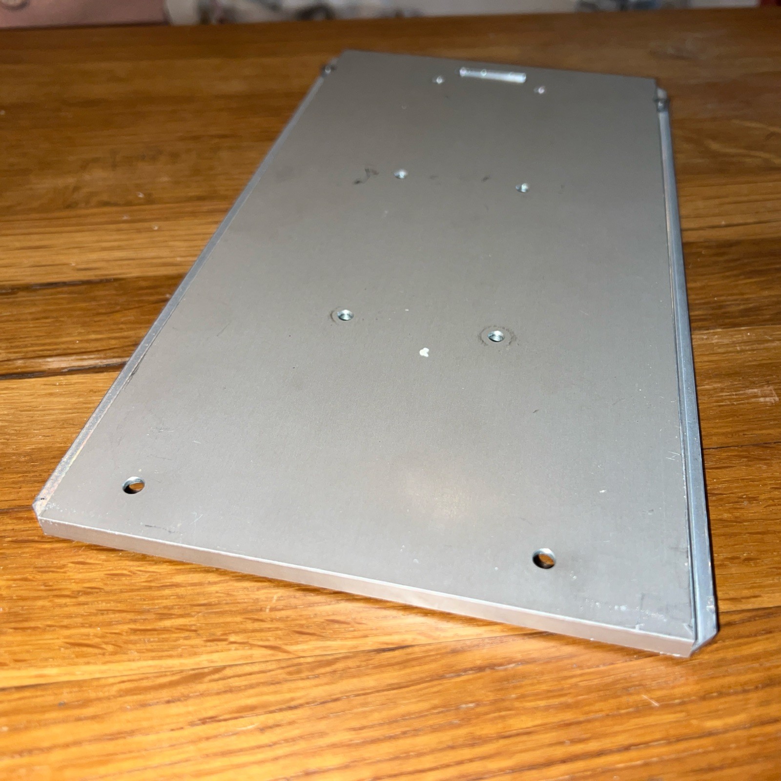 1/4″ Steel Plate, 10.5” x 5 5/16” with 8 screw holes