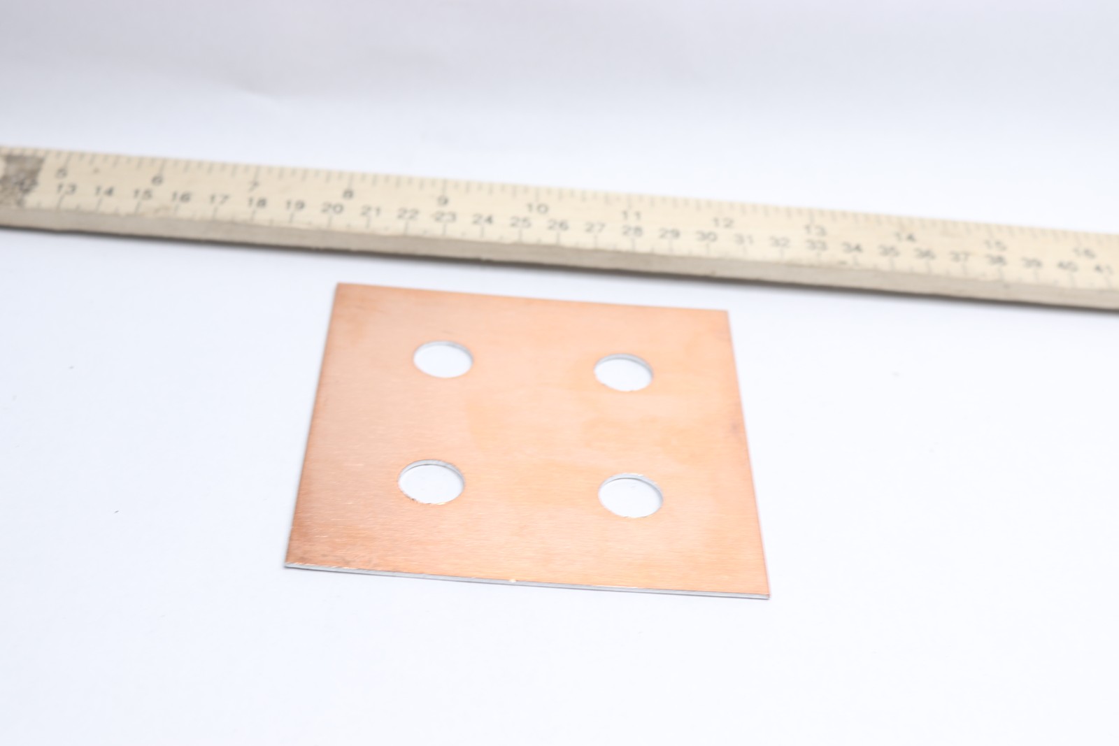 Plate Aluminum 9/16″ Bored 4″ x 4″ x 1/32″ ATP-D