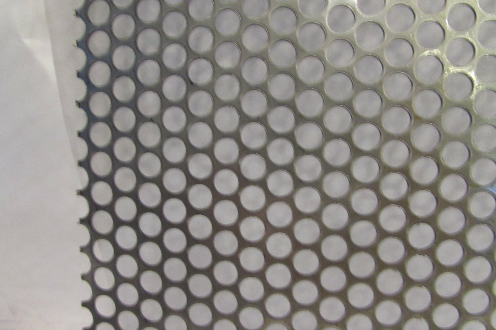 1/4″HOLES ON 5/16″CENTER–20 GA. STAINLESS PERFORATED SHEET–6″ X 8-1/4″
