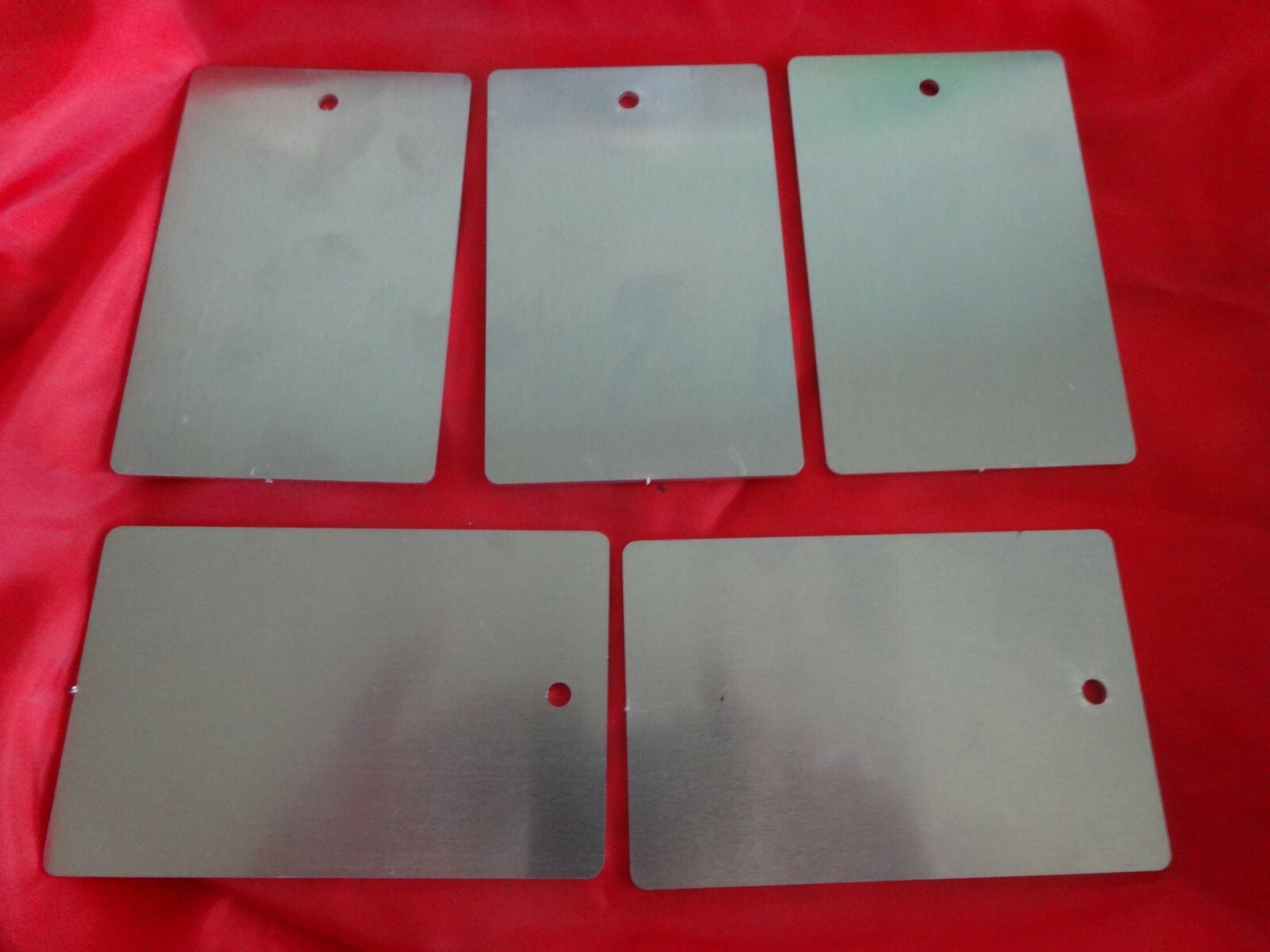 .080 Aluminum Sheet lasered tags 2 5/8″ x 4 1/16″ with 1/8 hole. 5 pieces